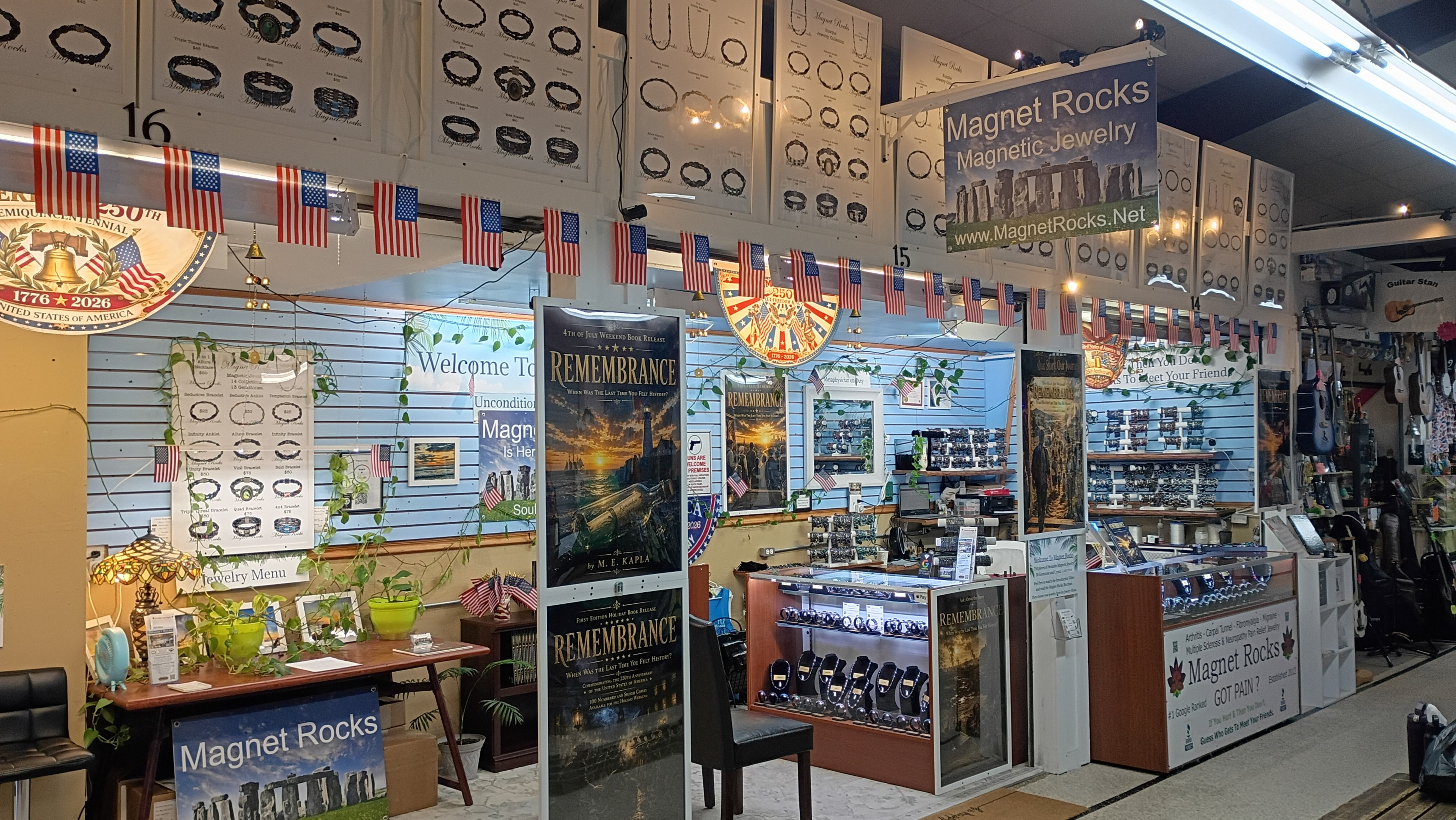 Magnetic bracelets and jewelry displayed inside the Magnet Rocks booth at the Daytona Flea & Farmers Market — rows of bracelets organized by style and color